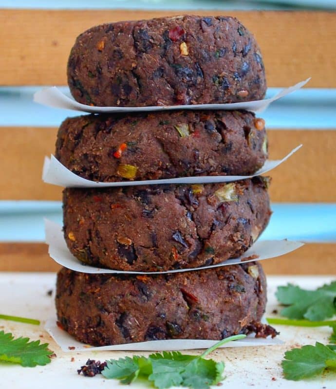 a stack of vegan black bean burgers