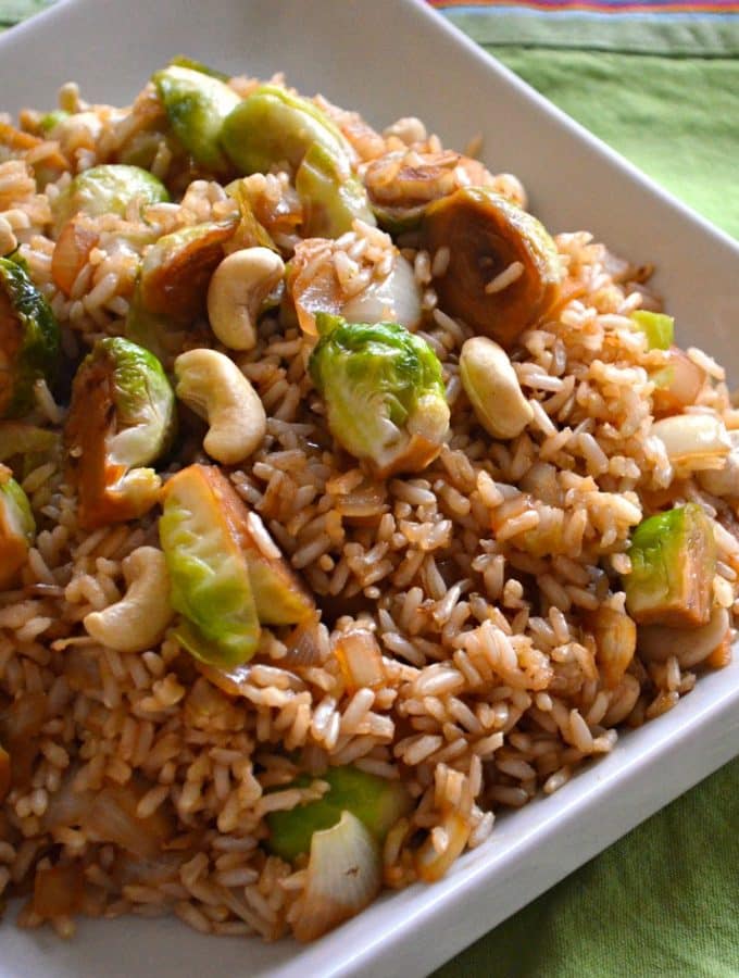 A simple, super speedy & delicious brussels sprout & cashew fried rice which brings together fresh, sweet brussels sprouts, nutty brown rice & buttery cashew nuts in a delicious tamari, maple sauce.