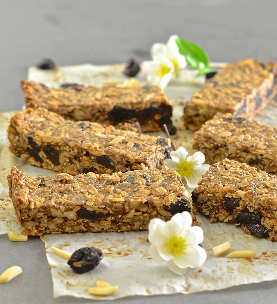 Plump, chewy dried cherries, crunchy almonds & wholesome oats & seeds make these Cherry Almond Granola Bars the perfect healthy snack or on the go breakfast. They are completely oil free, very lightly sweetened & come with bake or no bake options!