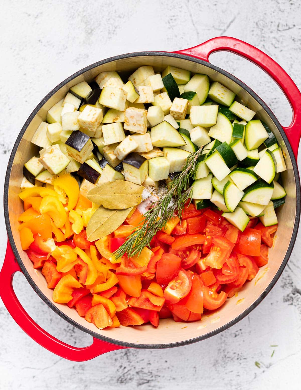 various diced vegetables in a dutch oven