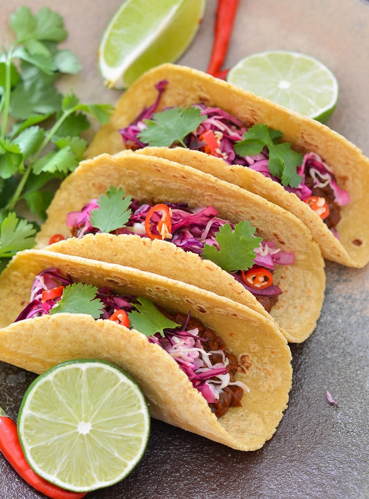 Enchilada Lentil Taco topped with zesty lime slaw.