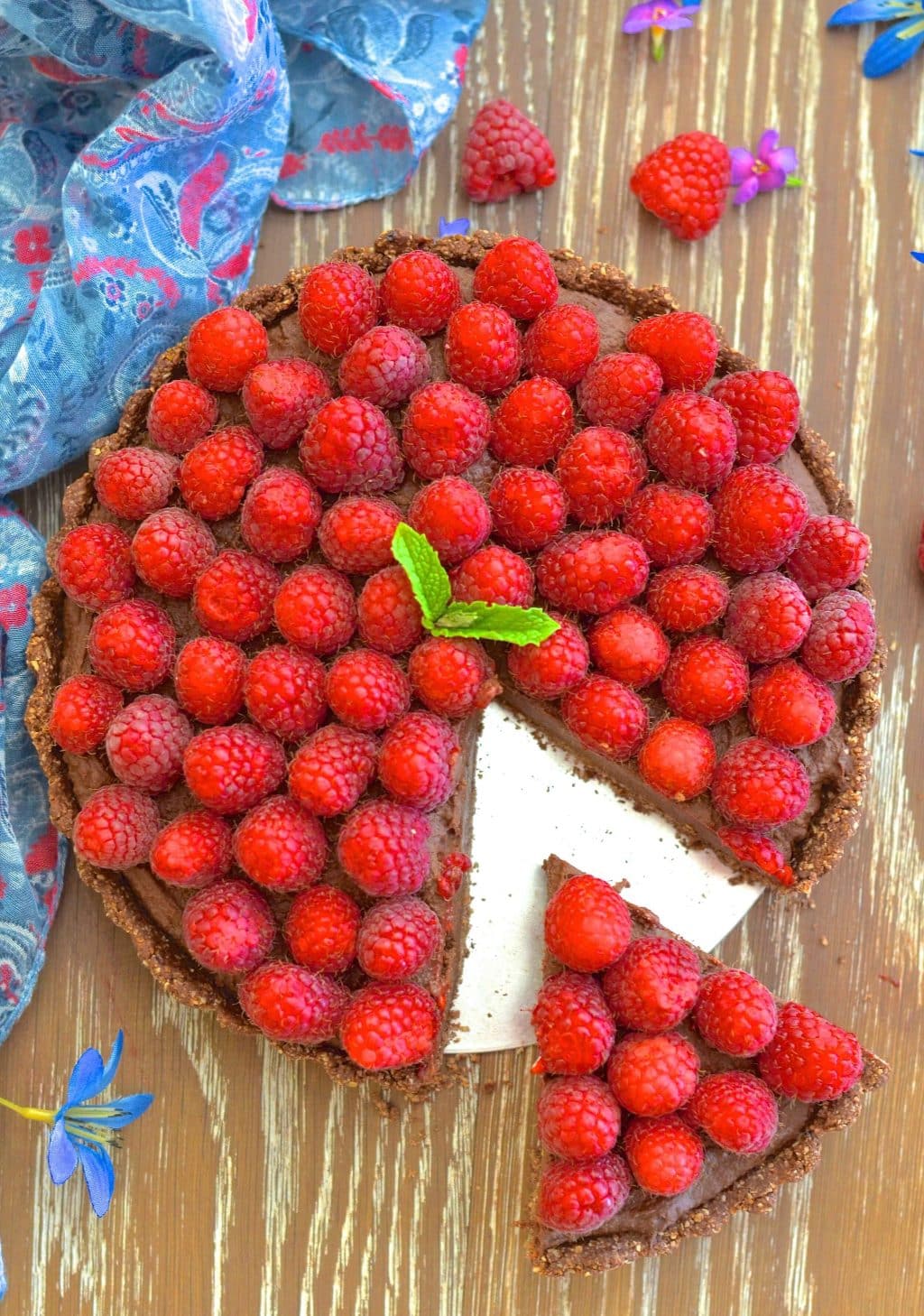 Want a dessert that looks and tastes decadent but is secretly quite good for you? I've got you covered with my Healthy Raspberry Chocolate Fudge Tart!