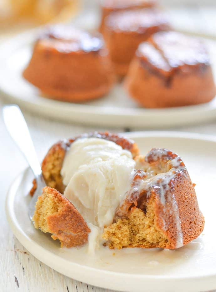 pineapple upside down cupcake with ice cream midway through being eaten