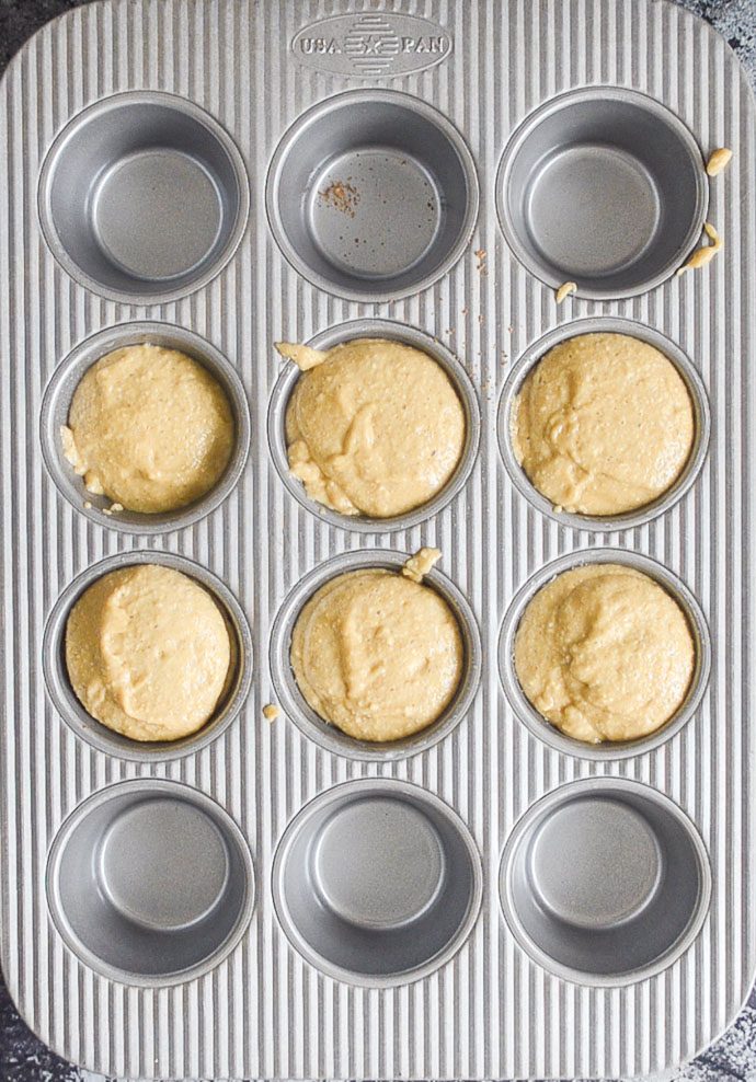 pineapple upside down cupcakes in muffin pan prior to baking