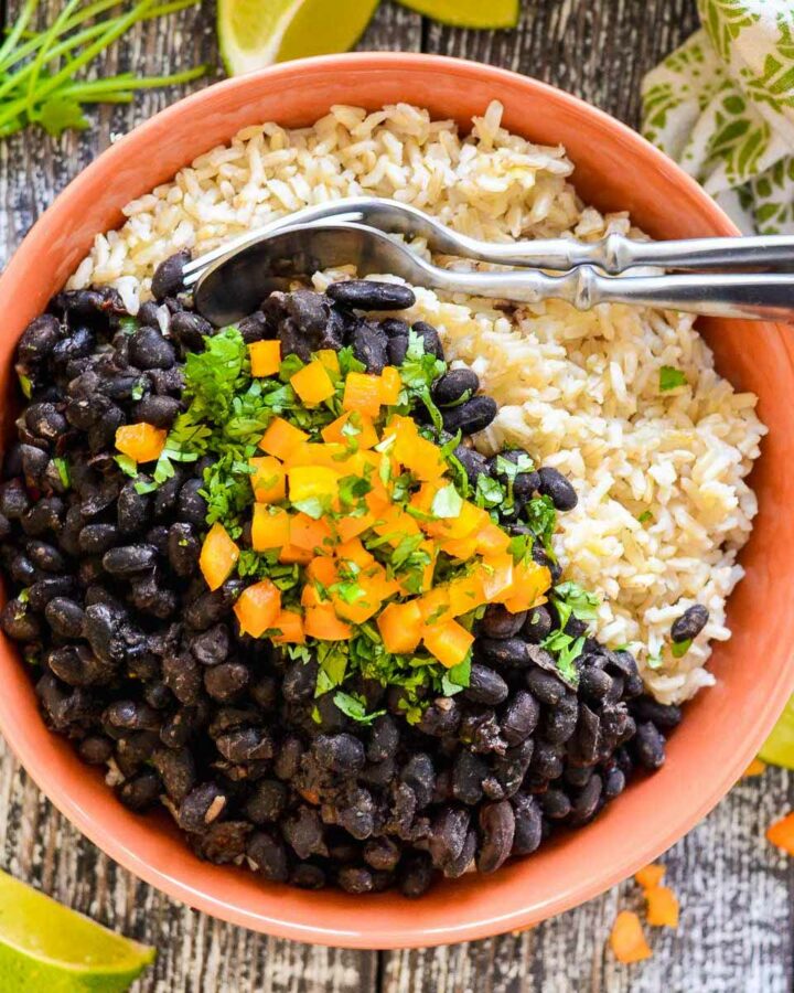 a bowl of sloe cooker black beans over rice