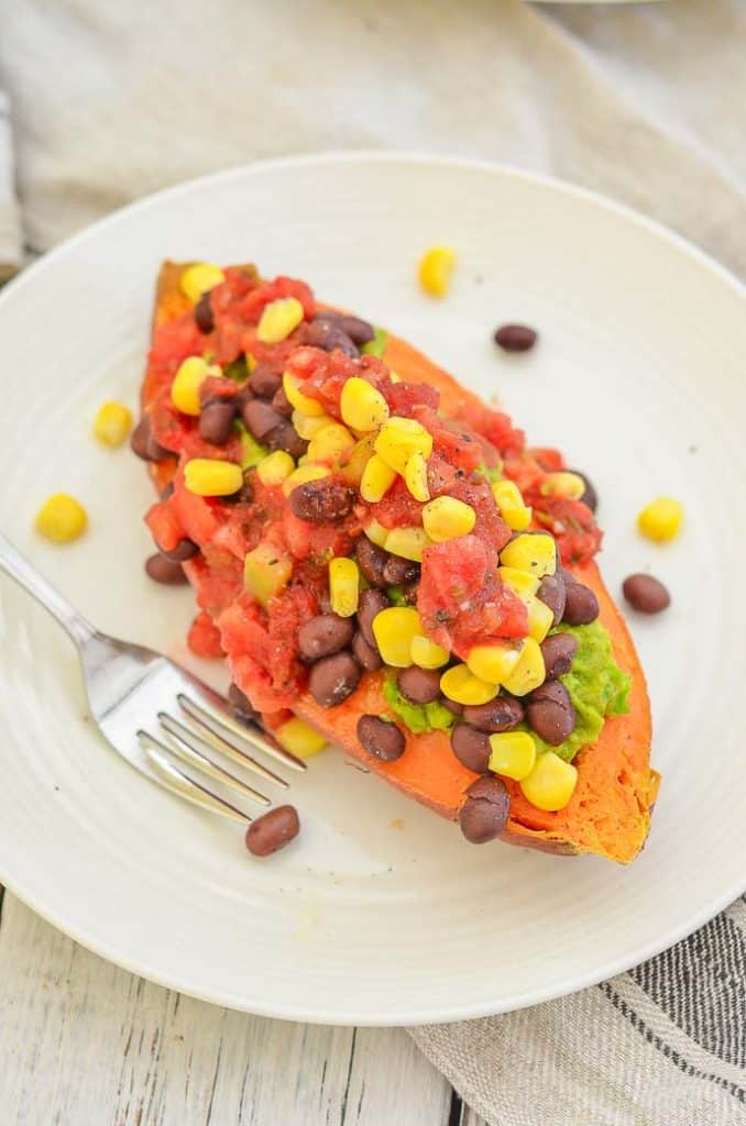 Sweet Potato Breakfast Boat on a plate with fork