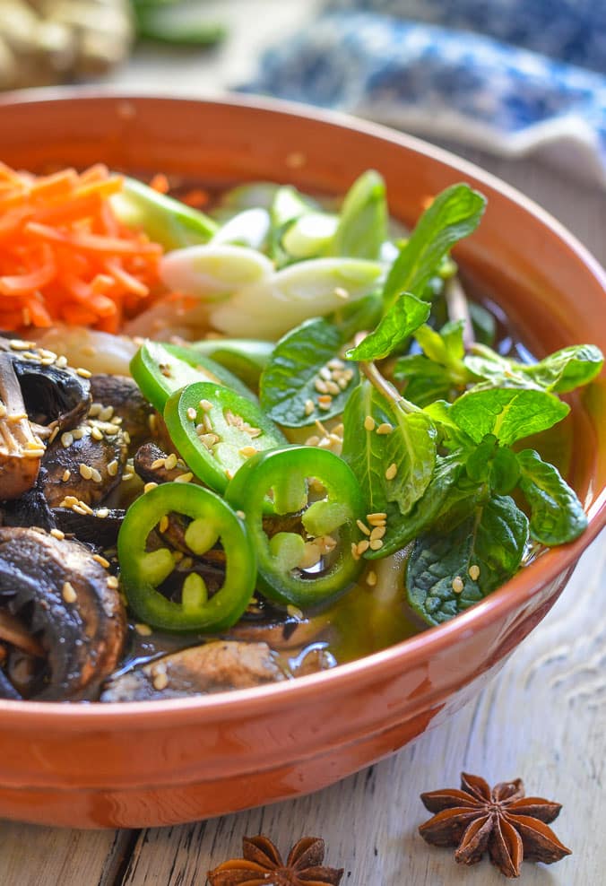 mint and jalapeños on a bowl of Udon Noodle Soup