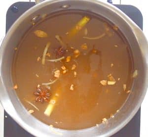 broth simmering in a pan - making udon noodle soup