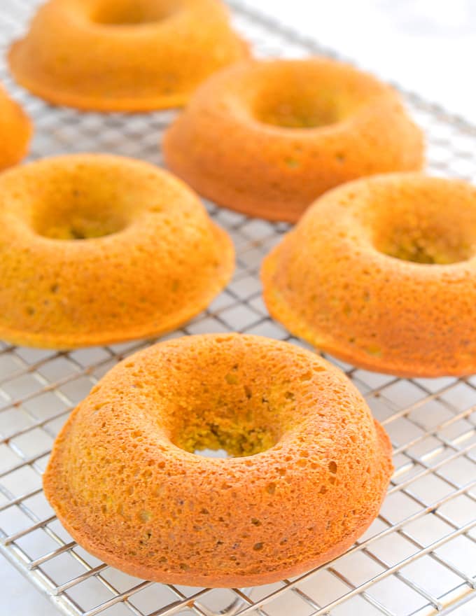 Pumpkin Donuts on a cooling rack, prior to being frosted