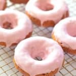 Soft & fluffy baked Vegan Raspberry Donuts with a sweet, smooth, pretty in pink glaze. All infused with sweet raspberry flavour & so delicious! Don't worry if you don't have a donut pan because they can also be made as muffins.