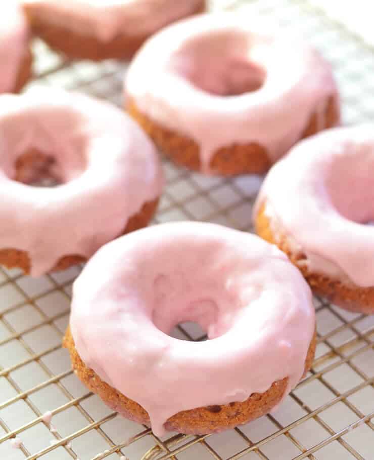 Soft & fluffy baked Vegan Raspberry Donuts with a sweet, smooth, pretty in pink glaze. All infused with sweet raspberry flavour & so delicious! Don't worry if you don't have a donut pan because they can also be made as muffins.