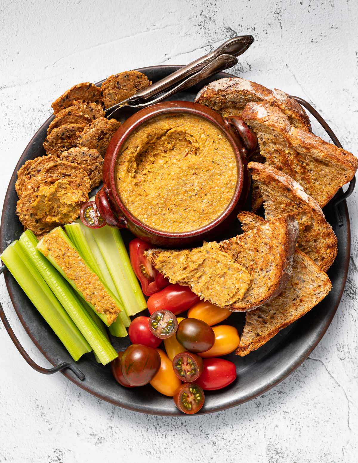 a tray of vegetable pate and accompiments