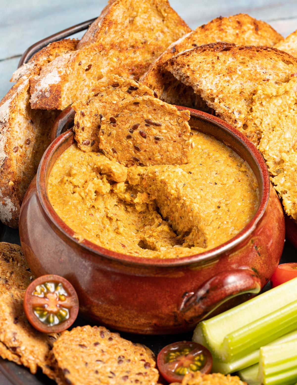 a bowl of vegetable pate with crackers